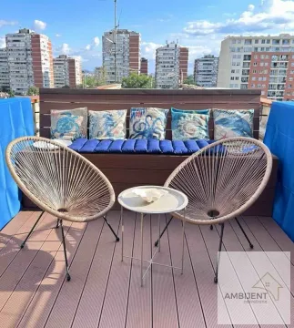 Furnished rooftop terrace with seating furniture and a city view. - image 10