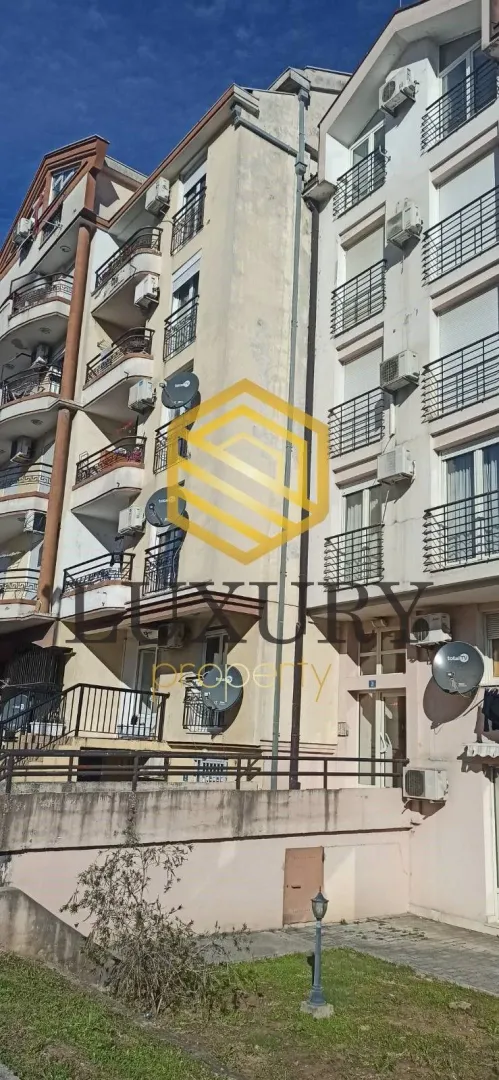 Exterior of an apartment building with balconies.