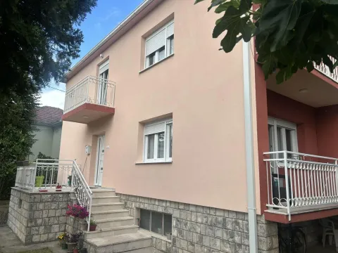 Facade of a two-story house with exterior stairs and balconies. - image 5