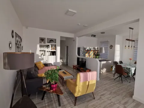 Spacious living room connected to the dining area and kitchen. - image 3