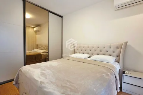 Bedroom with a double bed and a fitted wardrobe with a mirror. - image 17