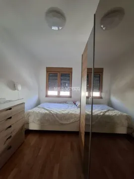 Bedroom with a double bed, wooden flooring, and a large wardrobe. - image 6