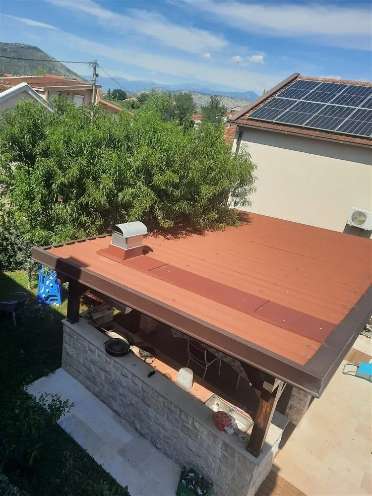 Covered outdoor kitchen in the backyard.