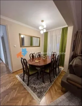 Living room with a dining table and chairs. - image 2
