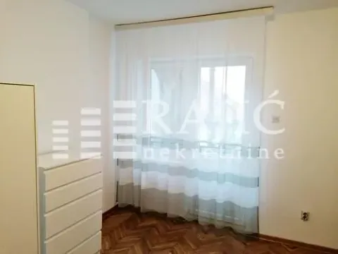 Bright bedroom with a white dresser and a window with curtains. - image 14