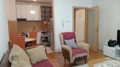 Open-concept living room connected to the kitchen. - image 3
