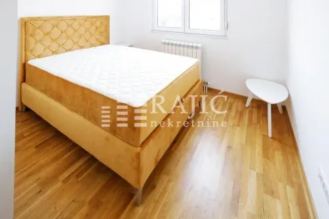 Bedroom featuring a double bed with a yellow upholstered headboard. - image 8