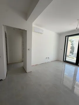 Empty room in a new building with ceramic tiles and an installed air conditioner. - image 8