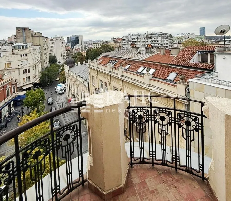 View from the terrace overlooking city streets and surrounding buildings.