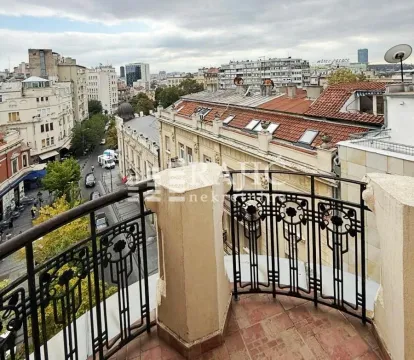 View from the terrace overlooking city streets and surrounding buildings. - image 9