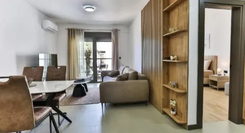 Living room with dining area and access to the terrace. - image 12