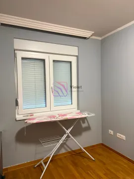 Empty room with a window and an ironing board. - image 13