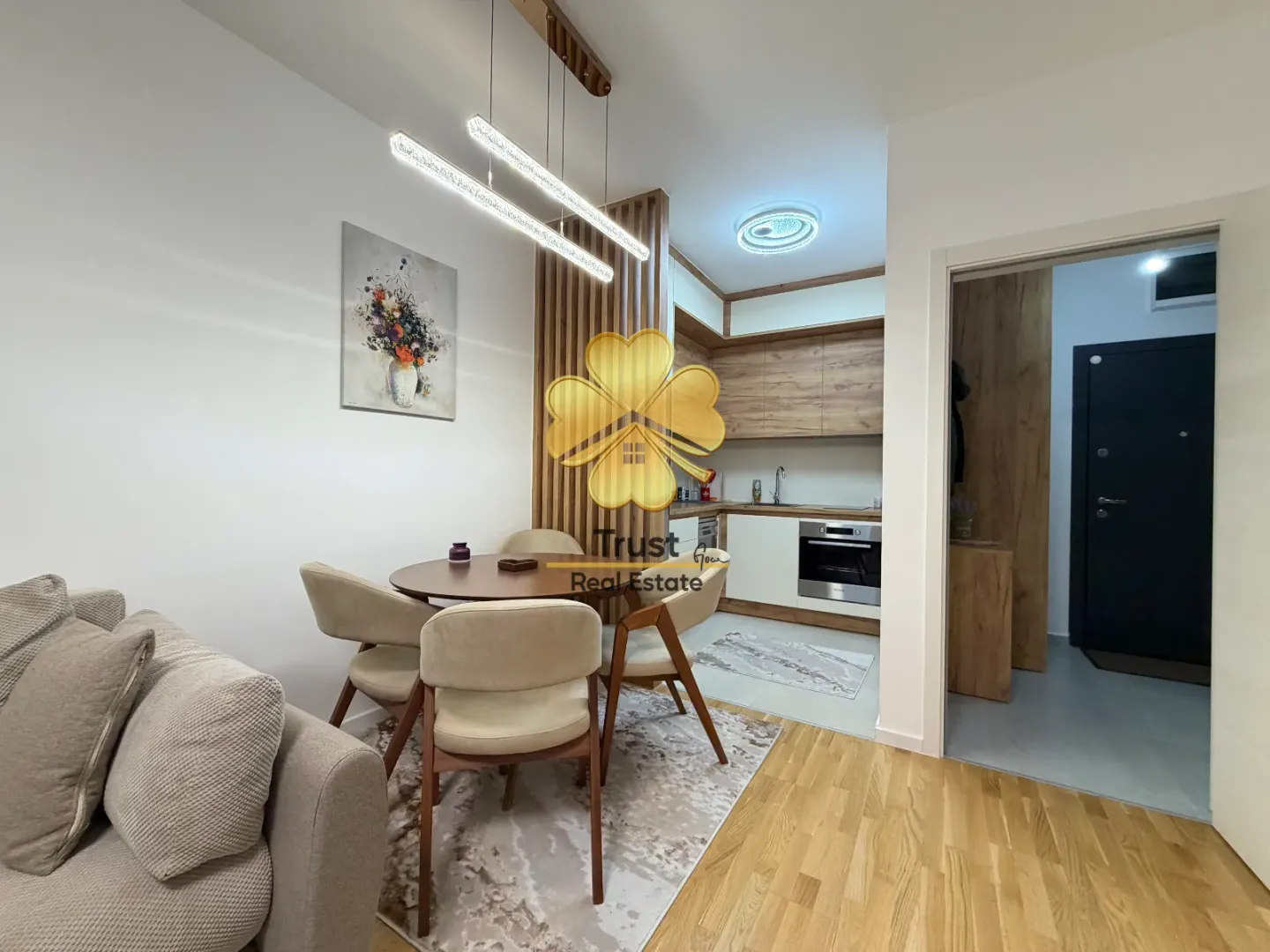 Living room with dining area and open kitchen.