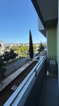 View from the balcony overlooking the street and city. - image 3