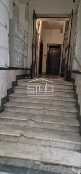 Building entrance with marble stairs and mailboxes. - image 4