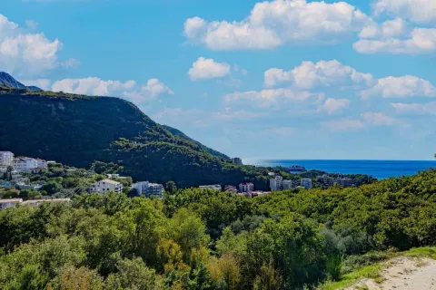 View of the mountains, greenery, and the sea from the location. - image 7