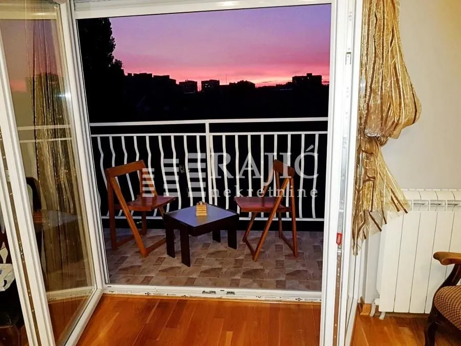 View of the terrace and city landscape at dusk.