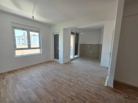 Empty bright room with hardwood flooring and windows. - image 20