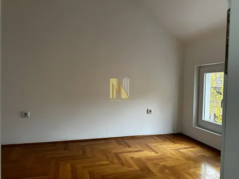 Empty room with parquet flooring and white walls. - image 3