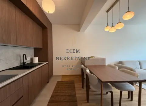 Modern kitchen with wooden cabinetry and a dining area. - image 7