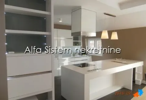 Modern kitchen with white cabinetry and an island. - image 6