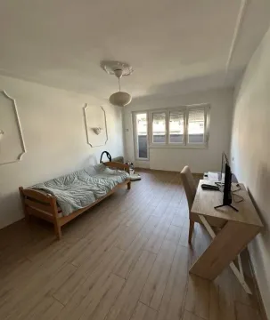 Bedroom with a bed and a desk. - image 2