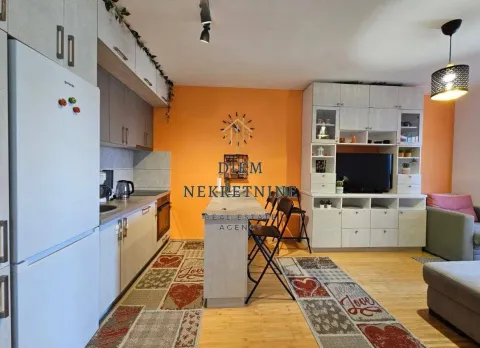 Living room with kitchen and dining area. - image 2