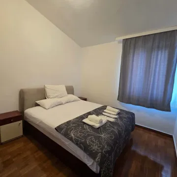 Bedroom with a double bed and a nightstand. - image 3
