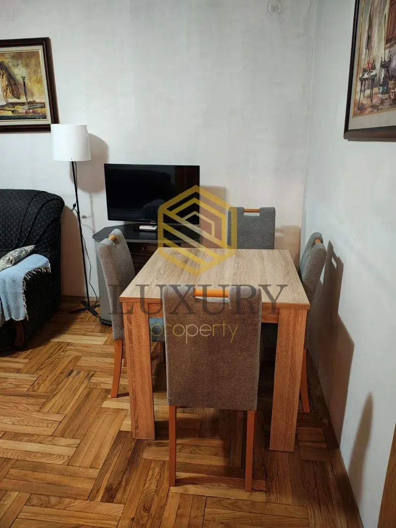Living room with a dining table and chairs.