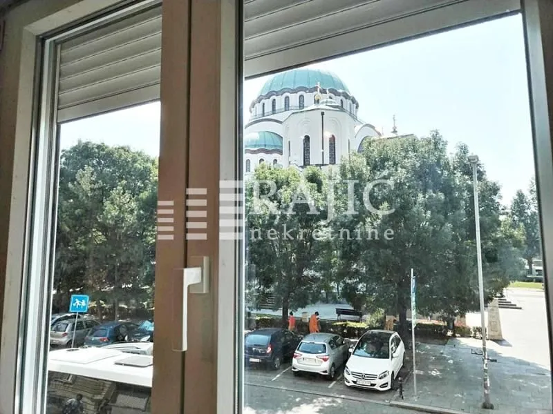 View through the window of a temple and urban surroundings.