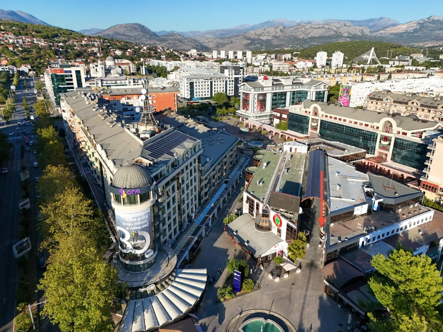 Aerial view of the city neighborhood with buildings and streets.