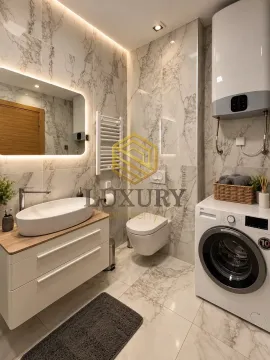 Modernly equipped bathroom with washing machine and marble tiles. - image 2