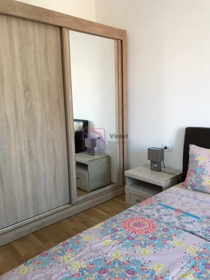 Bedroom with a large wardrobe and a double bed.