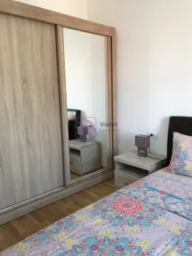 Bedroom with a large wardrobe and a double bed. - image 21