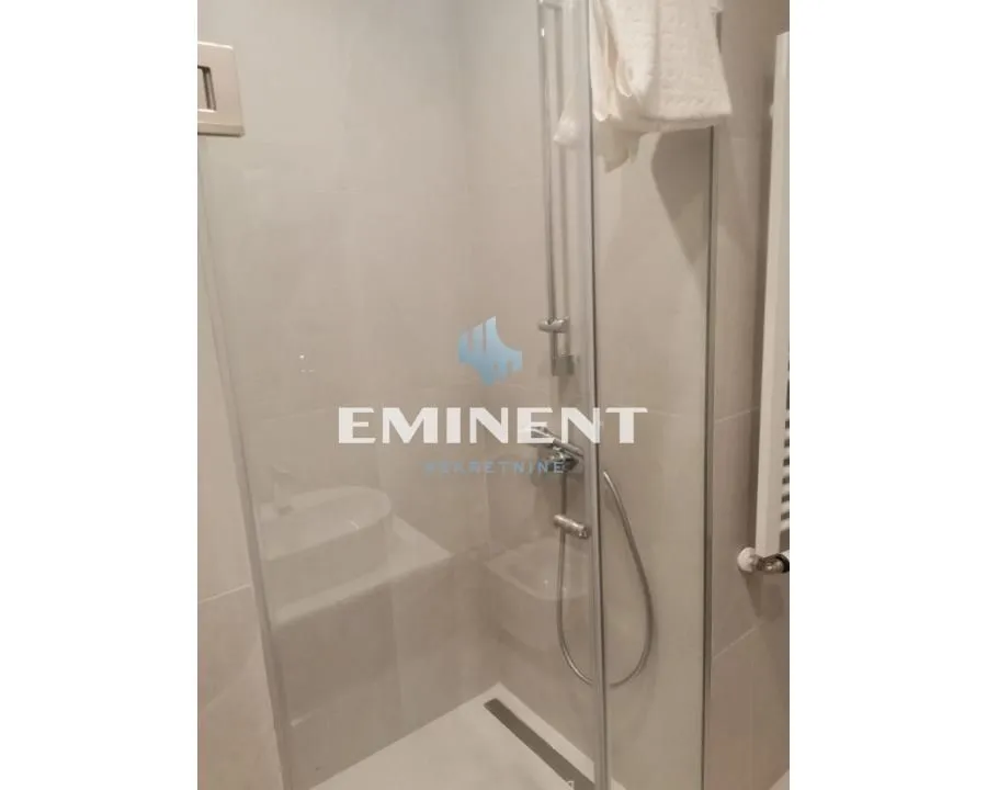 A view of a modern shower enclosure in the bathroom.