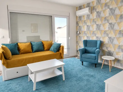 Living room with a yellow sofa, a blue armchair and access to the terrace. - image 2