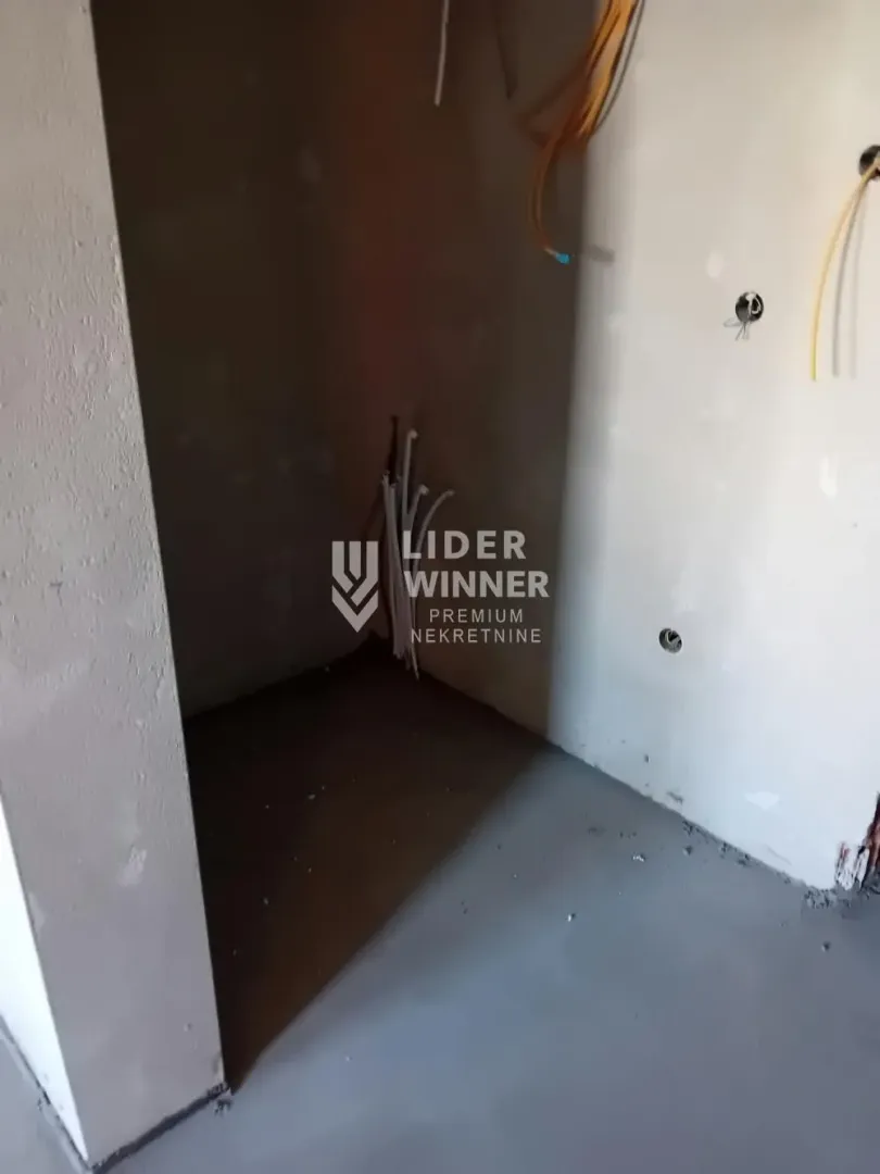 View of a section of a room under construction with installed wiring.