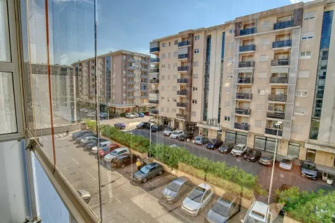 View from the terrace overlooking surrounding residential buildings and parking lot. - image 7