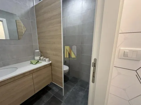 Modern bathroom with sink and shower cabin. - image 17