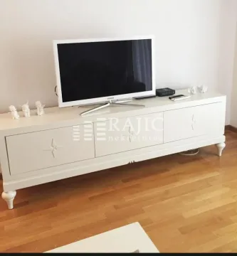 White TV cabinet in the living room. - image 2
