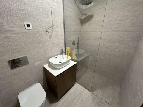 Modernly equipped bathroom with a walk-in shower. - image 8