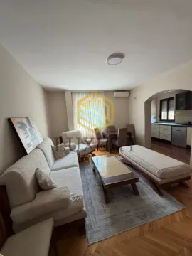 Living room with sofa set and dining area. - image 12