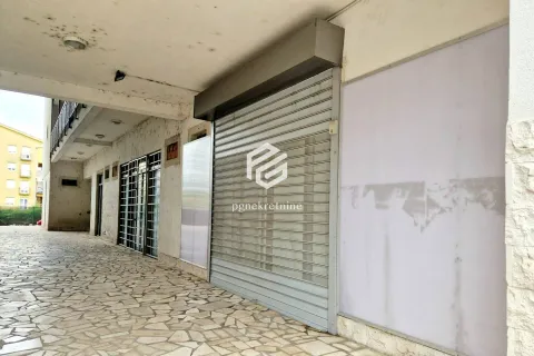 Exterior view of a commercial space with roller shutter on the ground floor of the building. - image 6