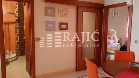 View of the hallway, bathroom, and dining area in the apartment. - image 4