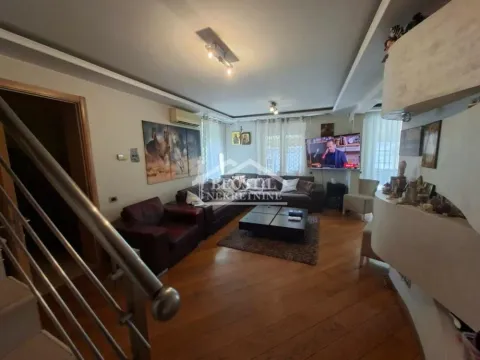 Spacious living room with seating area and television. - image 3