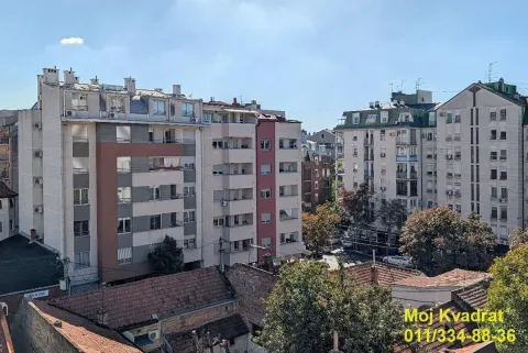 View from the window overlooking surrounding buildings and the cityscape. - image 3