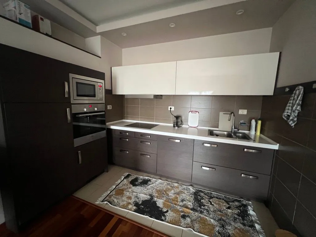 Modern kitchen with built-in cabinetry and appliances.