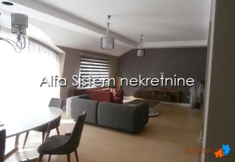 Spacious living room with seating area and dining space. - image 2