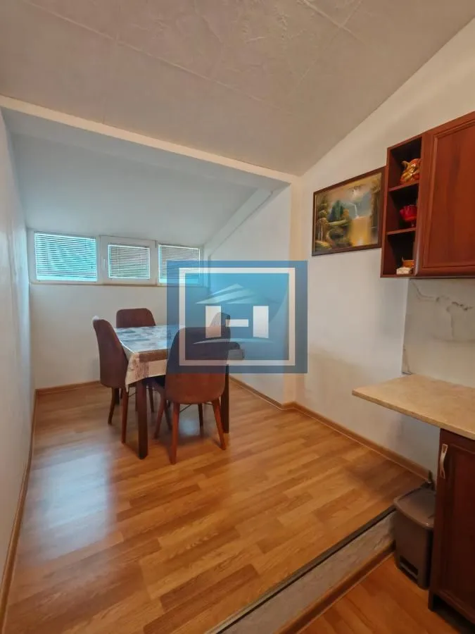Small kitchen with a dining table and chairs.