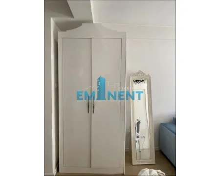 White wardrobe with a large mirror in the bedroom. - image 2